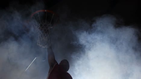 Sportsman-dunking-basketball-in-hoop