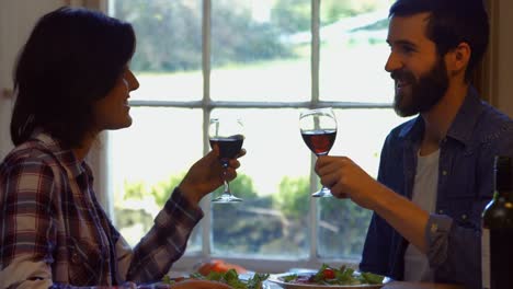 Couple-toasting-a-wine-glasses