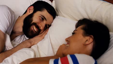 Couple-sleeping-together-on-bed