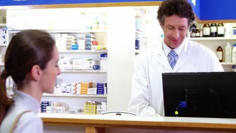 Pharmacist-receiving-payment-from-customer