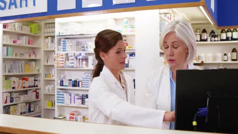 Pharmacists-maintaining-a-record-of-medicine-on-computer