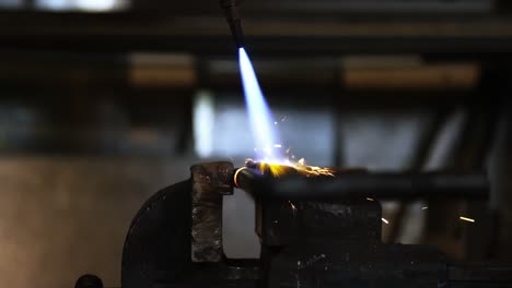Close-up-of-welder-using-welding-torch