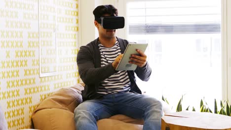 Business-executive-using-virtual-reality-headset-and-digital-tablet