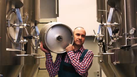 Brewer-carrying-keg-at-brewery