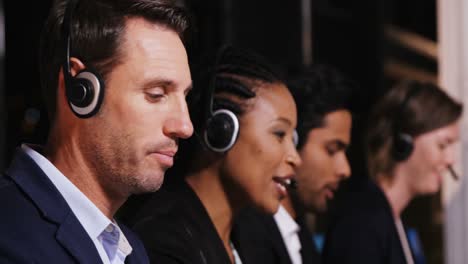 Business-executives-using-headsets