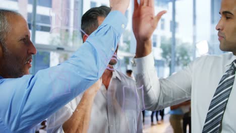 Business-people-giving-a-high-five-to-each-other