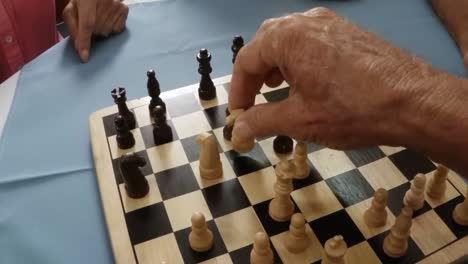 Close-up-of-hands-playing-chess
