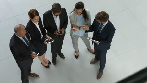Business-people-using-digital-tablet-and-mobile-phone