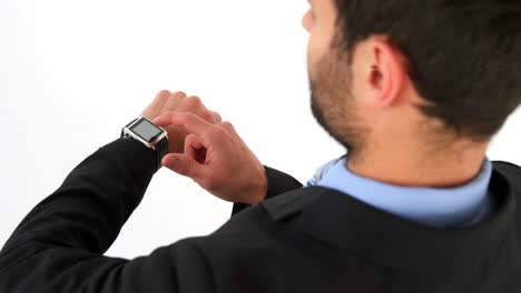 Businessman-using-his-smart-watch
