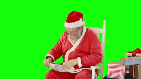 Weihnachtsmann-Hält-Schriftrolle-Und-Geschenkbox
