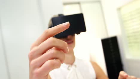 Woman-using-virtual-reality-headset-in-optical-clinic