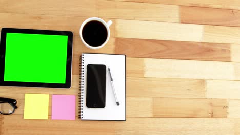 Digital-tablet,-coffee,-spectacles,-diary,-mobile-phone,-pen-and-sticky-notes