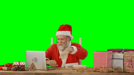 Papá-Noel-Usando-La-Computadora-Portátil