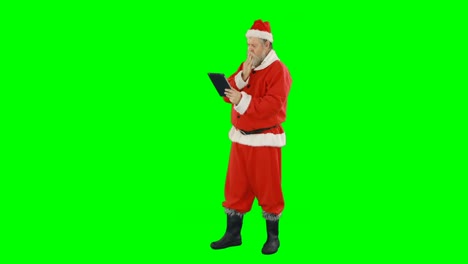 Santa-claus-using-digital-tablet