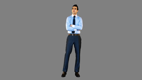 Businessman-standing-with-arms-crossed