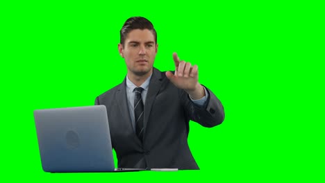 Businessman-using-digital-screen-and-laptop