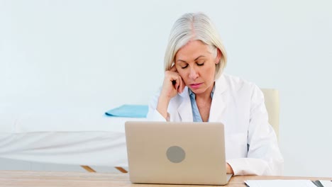 Female-doctor-using-laptop