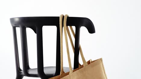 Handbag-hanging-on-a-chair
