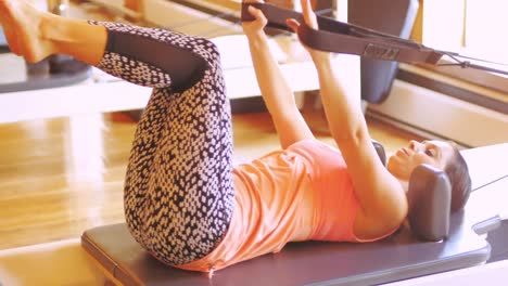 Woman-exercising-on-gym-equipment