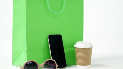 Shopping-bag,-mobile-phone,-sunglass-and-coffee