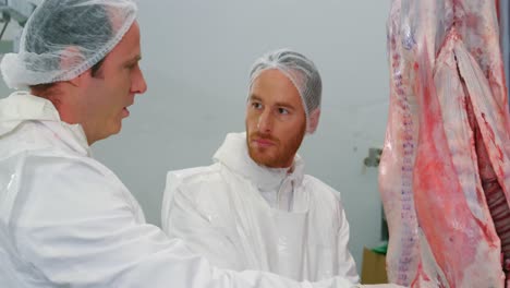 Team-of-butcher-examining-meat