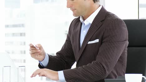 Close-up-of-businessman-shopping-online