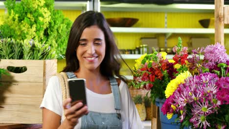 Woman-taking-selfie-with-flower-from-mobile-phone