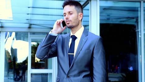 Businessman-talking-on-mobile-phone