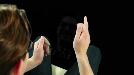 Man-pretending-to-be-using-futuristic-digital-tablet