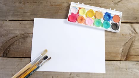 Watercolor-paint-and-paintbrushes-with-canvas