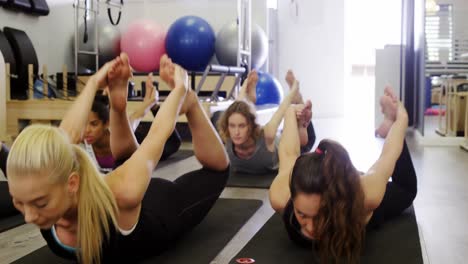 Beautiful-women-exercising-in-fitness-studio