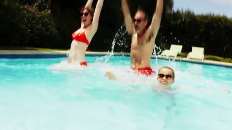 Parents-and-daughter-having-fun-in-poolside