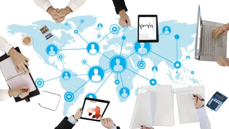 Business-executives-working-on-devices-on-map