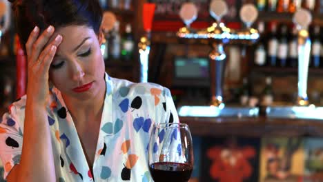 Sad-woman-having-red-wine