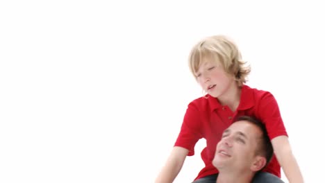 Father-giving-his-son-piggyback-ride