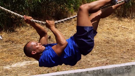Man-crossing-the-rope-during-obstacle-course