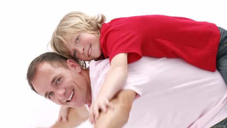 Dad-giving-his-son-piggyback-ride