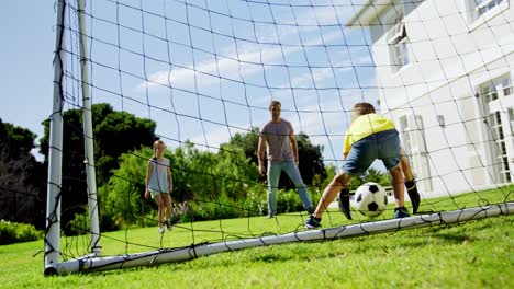 Father-and-kids-playing-football