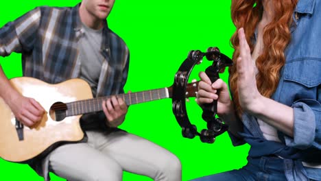 Musicians-playing-guitar-and-tambourine