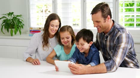 Happy-family-using-digital-tablet