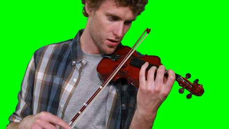 Close-up-of-male-musician-singing-while-playing-violin