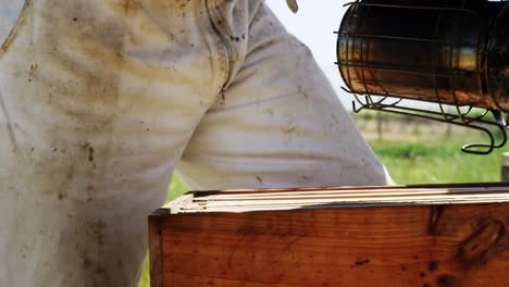 Beekeeper-smoking-the-bee-hive