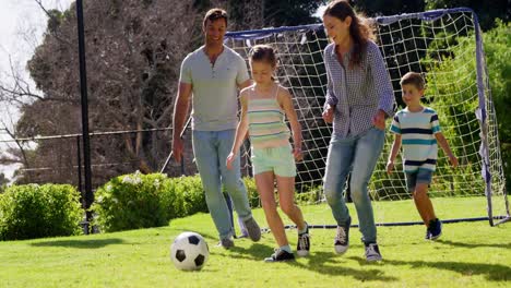 Happy-family-playing-football