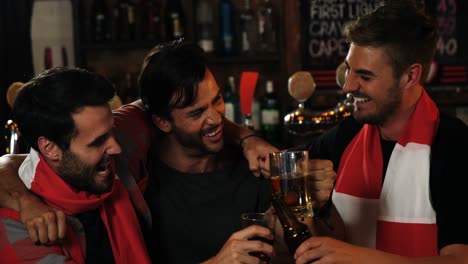Friends-having-beer-at-bar-counter-