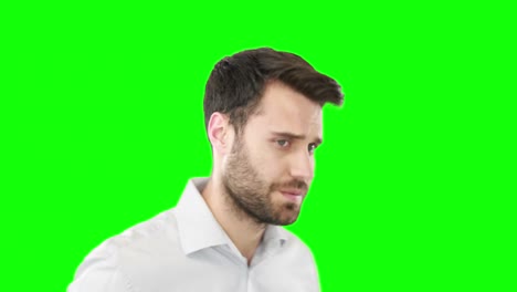 Worried-man-standing-against-green-screen