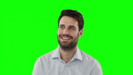 Young-man-standing-against-green-screen