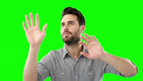 Man-pretending-to-touch-an-invisible-screen