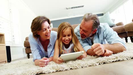 Family-using-digital-tablet-in-living-room