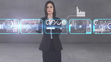 Businesswoman-using-digital-interface-screen-with-icons
