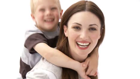 Woman-giving-son-piggyback-ride
